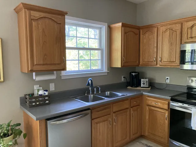 a bedroom with a bed and a dresser