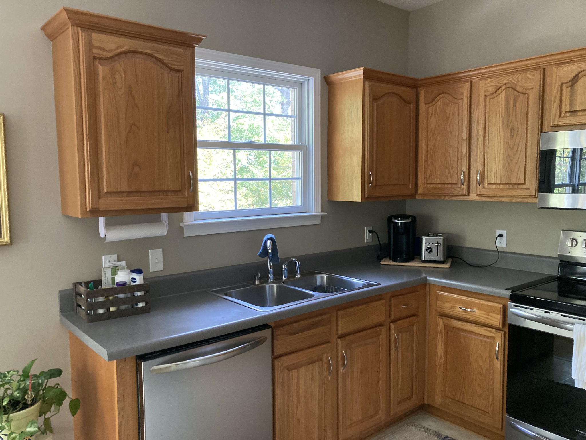 1225 Meeks Cemetery Road Burns, TN 37029 - Photo 24 of 66 a kitchen with stainless steel appliances granite countertop a sink stove and cabinets