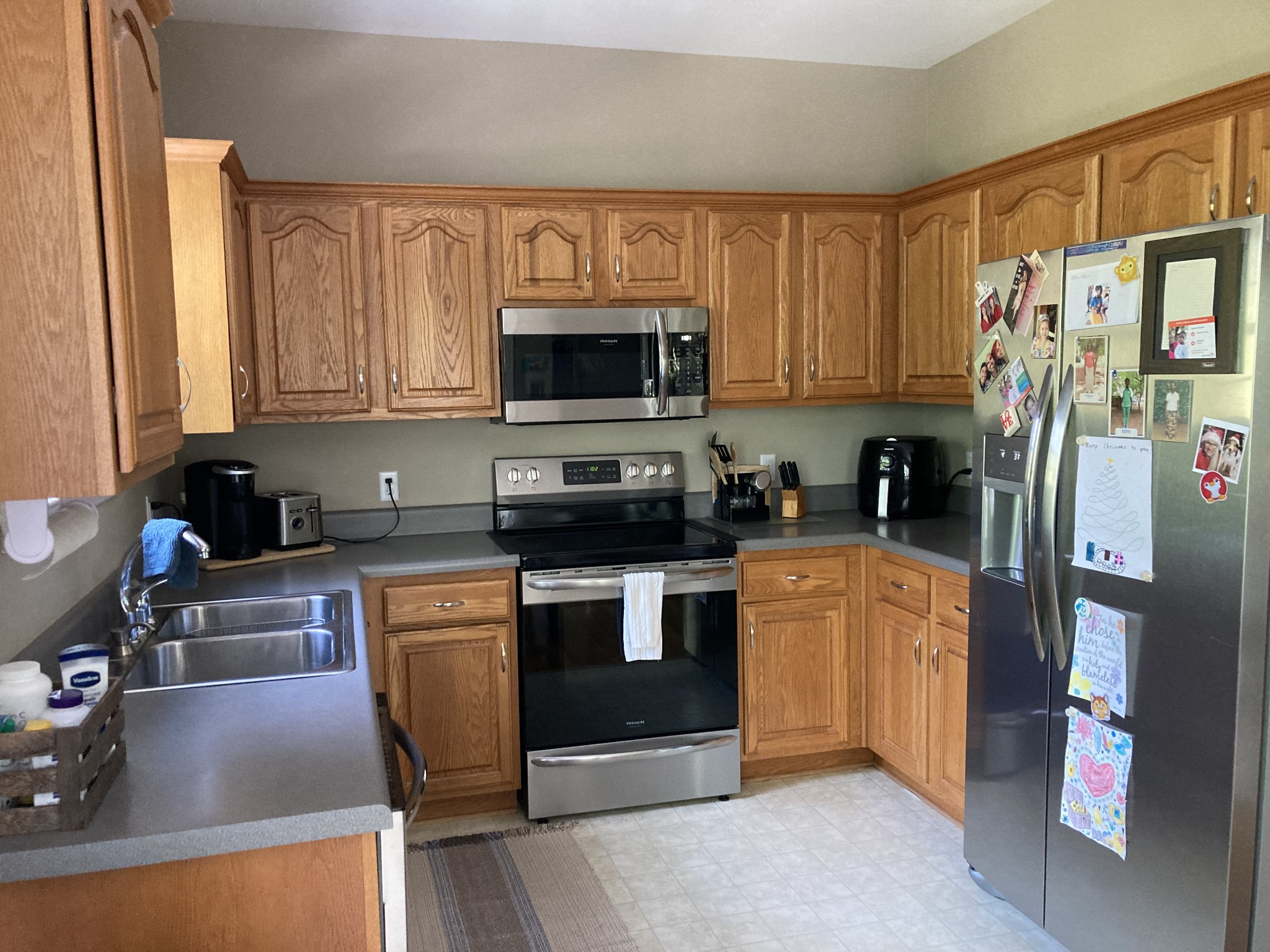 1225 Meeks Cemetery Road Burns, TN 37029 - Photo 25 of 66 a kitchen with stainless steel appliances granite countertop a refrigerator a stove top oven a sink and dishwasher