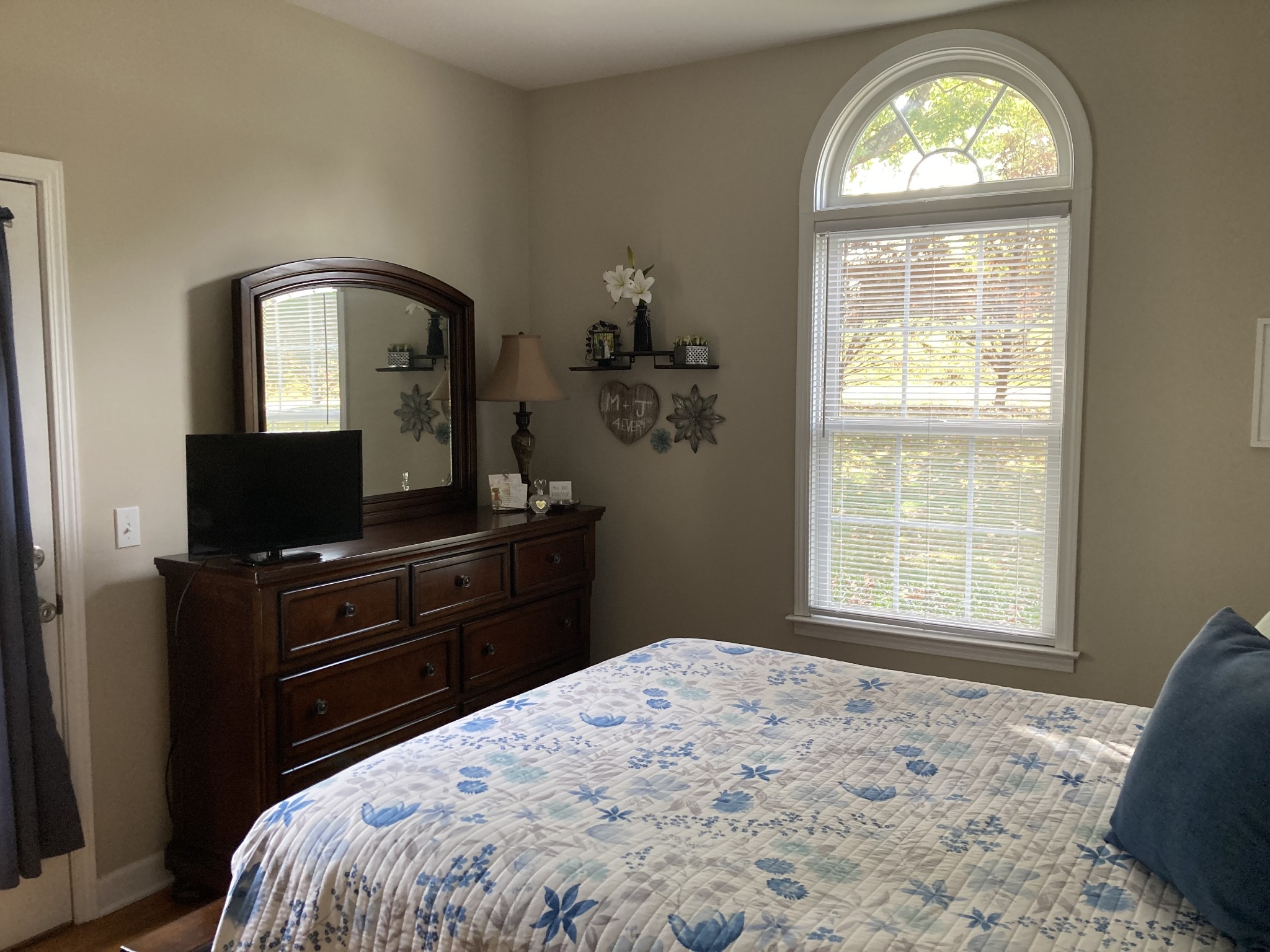 1225 Meeks Cemetery Road Burns, TN 37029 - Photo 29 of 66 a bedroom with a bed and a window