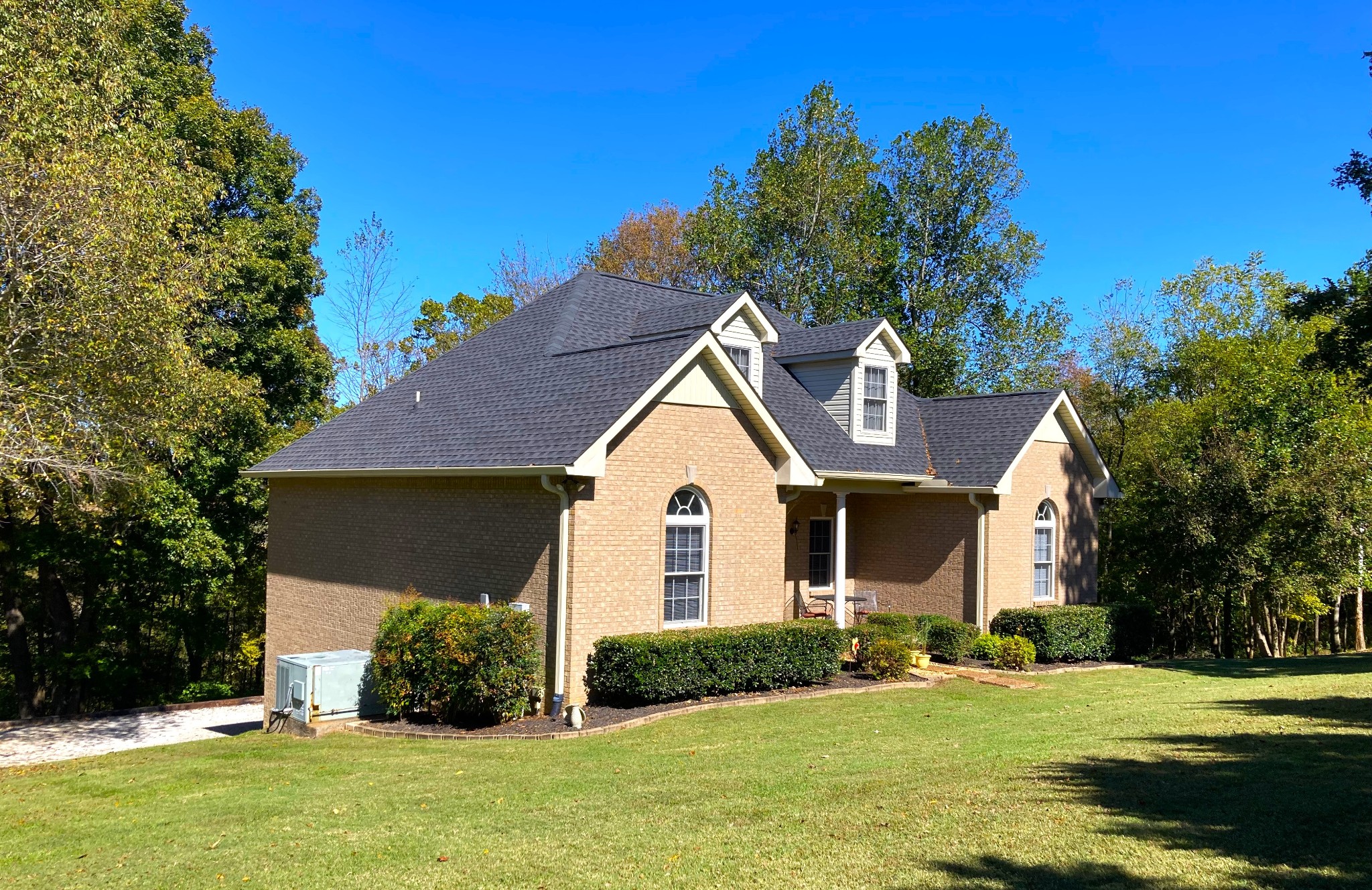 1225 Meeks Cemetery Road Burns, TN 37029 - Photo 3 of 66 a front view of a house with a yard