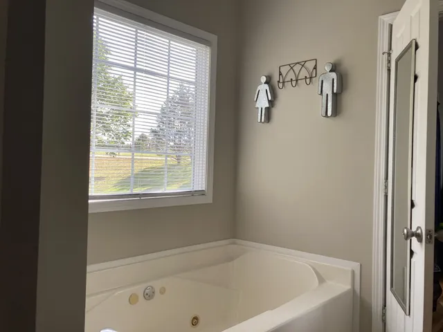 a close up of a bathtub in a bathroom