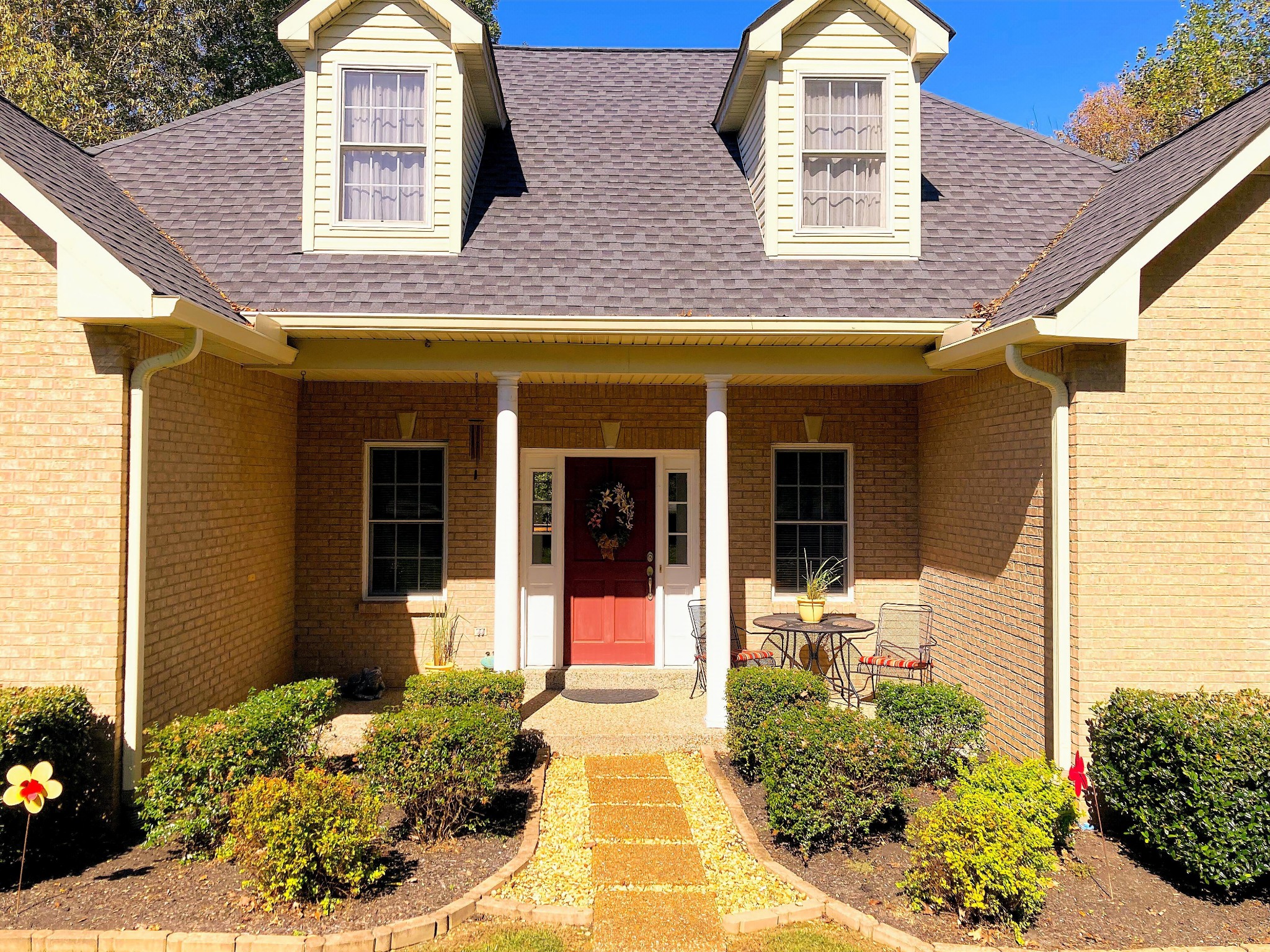 1225 Meeks Cemetery Road Burns, TN 37029 - Photo 4 of 66 a view of brick house with potted plants
