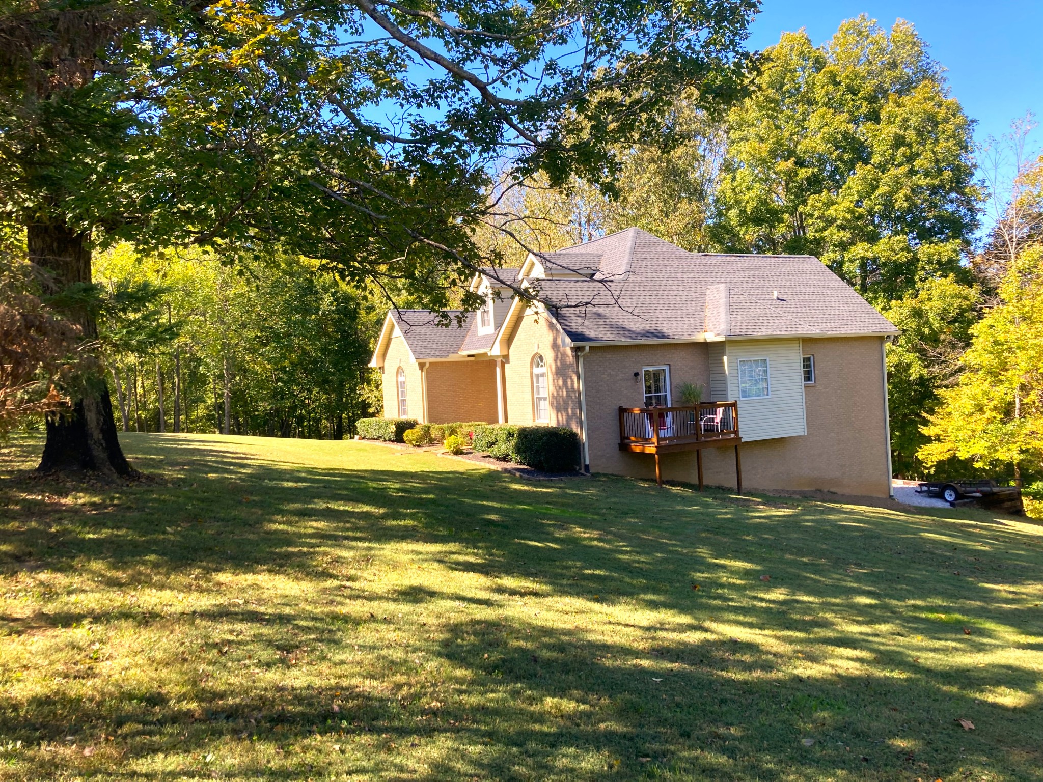 1225 Meeks Cemetery Road Burns, TN 37029 - Photo 10 of 66 a view of a house with a large tree