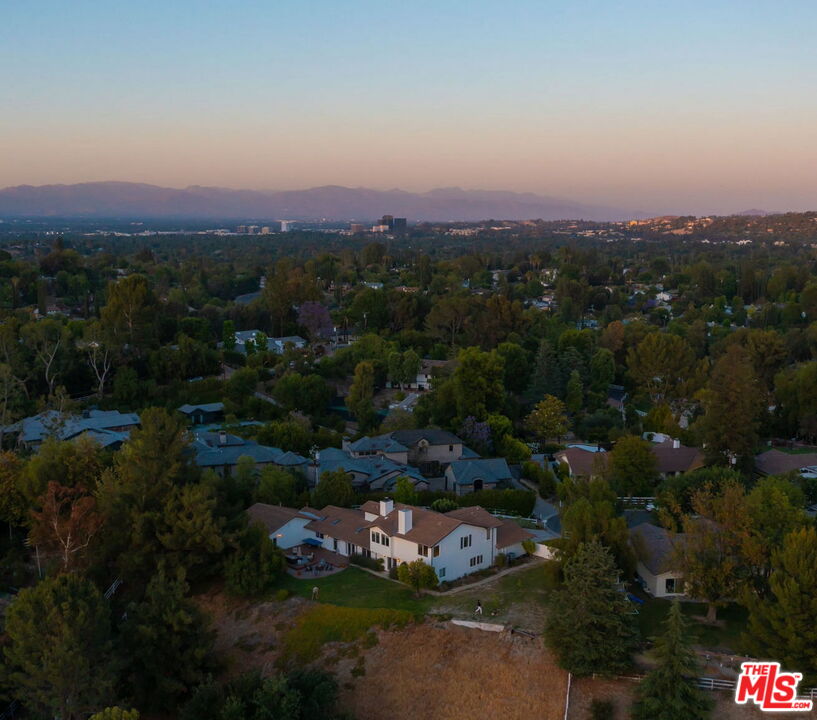 a view of a town with mountains in the background