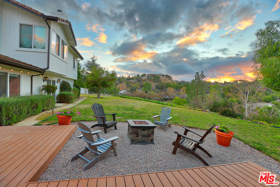 5845 Hilltop Road Hidden Hills, CA 91302 - Photo 13 of 16 a view of a outdoor with a table and chairs