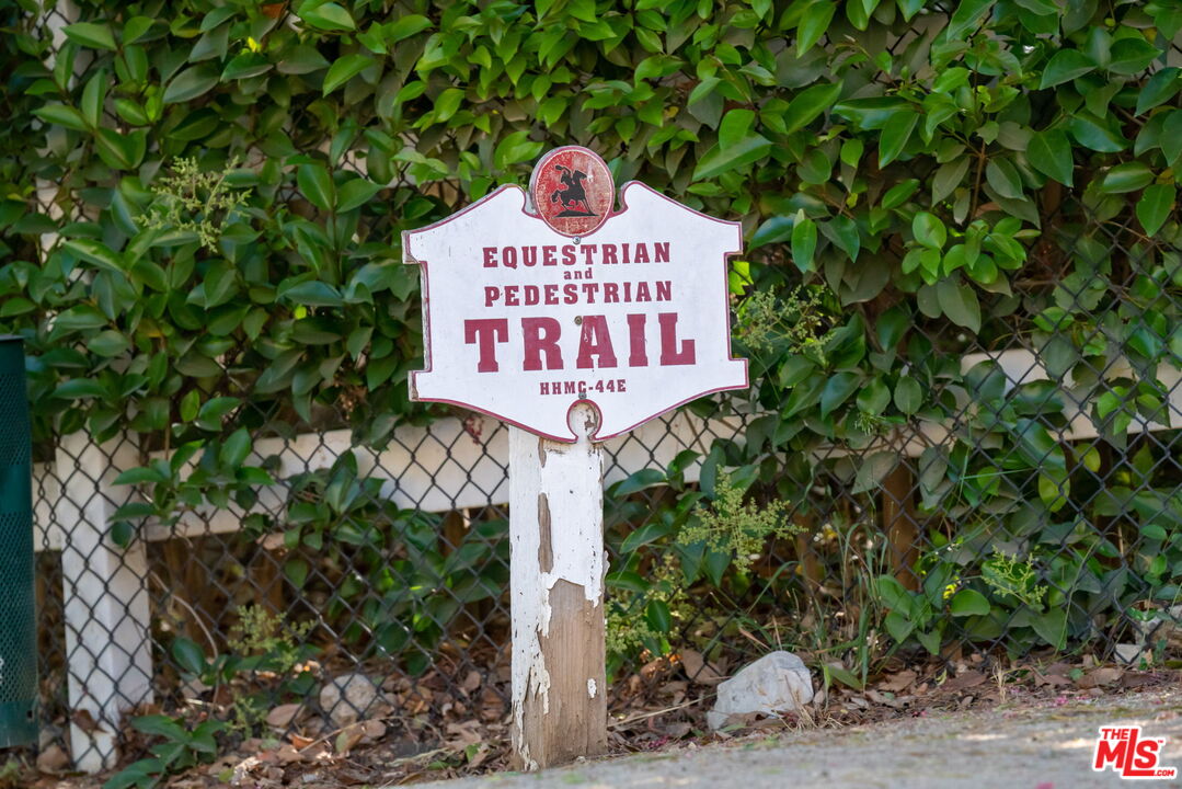 5845 Hilltop Road Hidden Hills, CA 91302 - Photo 6 of 16 a sign that is on a tree