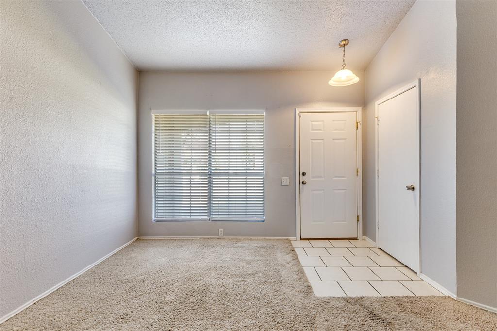 3820 River Birch Road Fort Worth, TX 76137 - Photo 7 of 22 an empty room with windows and cabinet