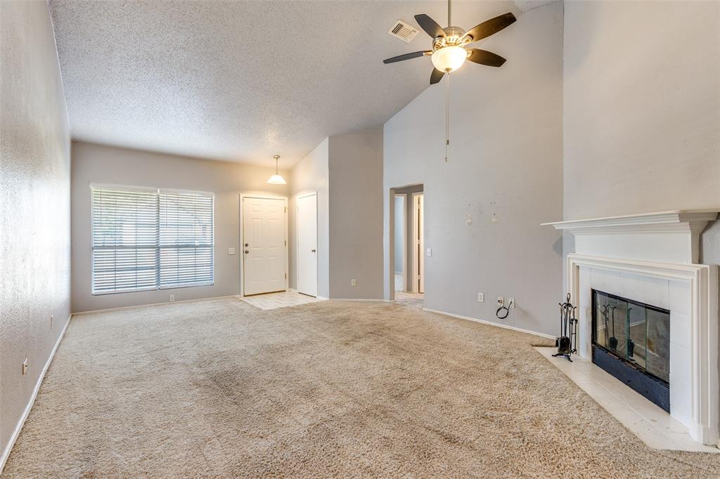 3820 River Birch Road Fort Worth, TX 76137 - Photo 8 of 22 a view of an empty room with a fireplace