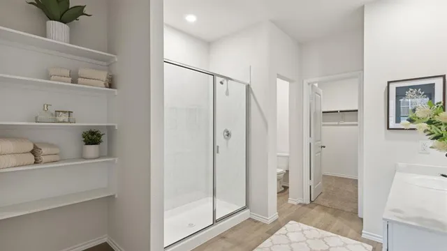a bathroom with a shower and a sink