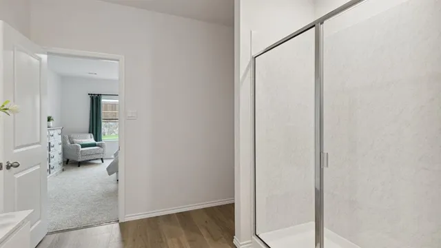 a view of a bedroom from a hallway