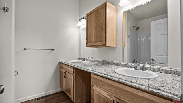 a white bath tub sitting next to a white cabinet