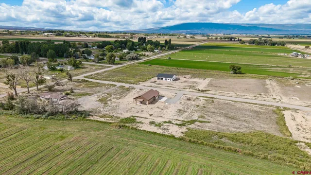 a view of a field with an ocean beach