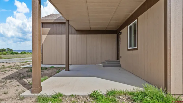 a view of a field with an ocean view