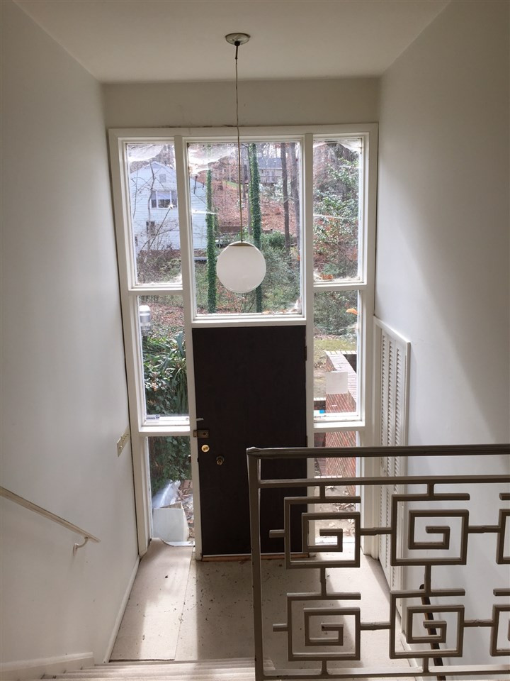 Very cool entry foyer has kept the modern and very cool features that make this home it's own. Interior