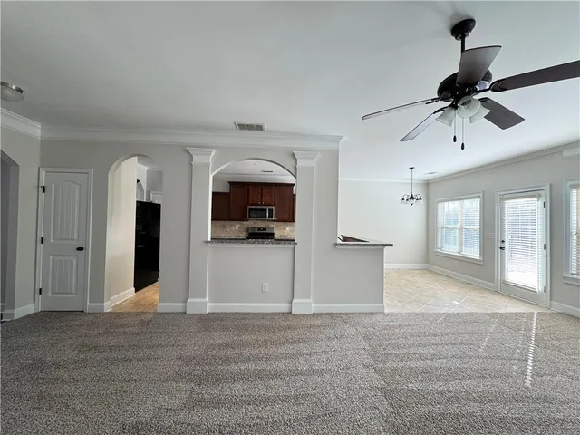 a view of a kitchen with a sink and a window