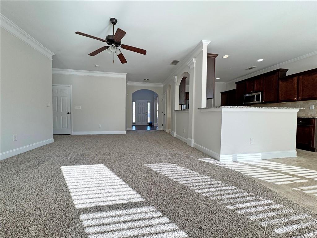 2251 Chance Lane Grayson, GA 30017 - Photo 14 of 35 a view of an empty room with kitchen and a window