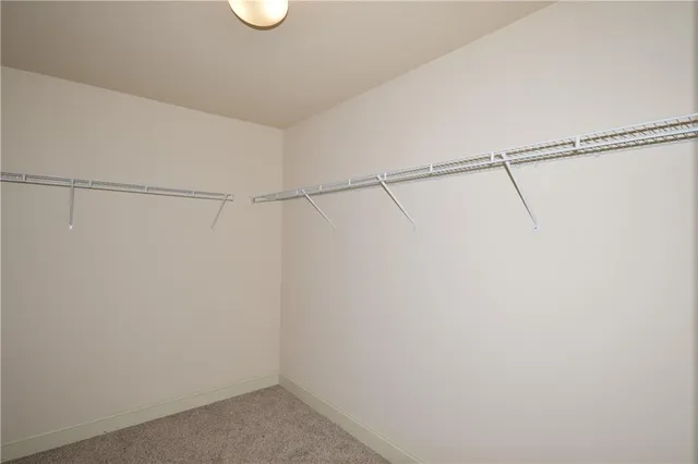 a view of a hallway with entryway door