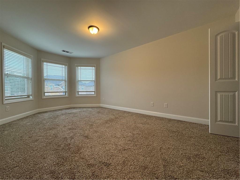 2251 Chance Lane Grayson, GA 30017 - Photo 26 of 35 an empty room with windows and closet
