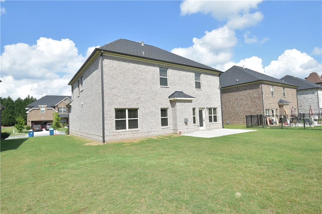 2251 Chance Lane Grayson, GA 30017 - Photo 33 of 35 a front view of a house with a garden