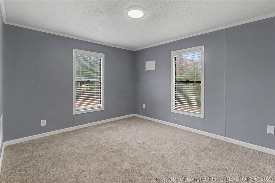 1512 Seabrook School Road Fayetteville, NC 28312 - Photo 13 of 30 a view of an empty room with a window