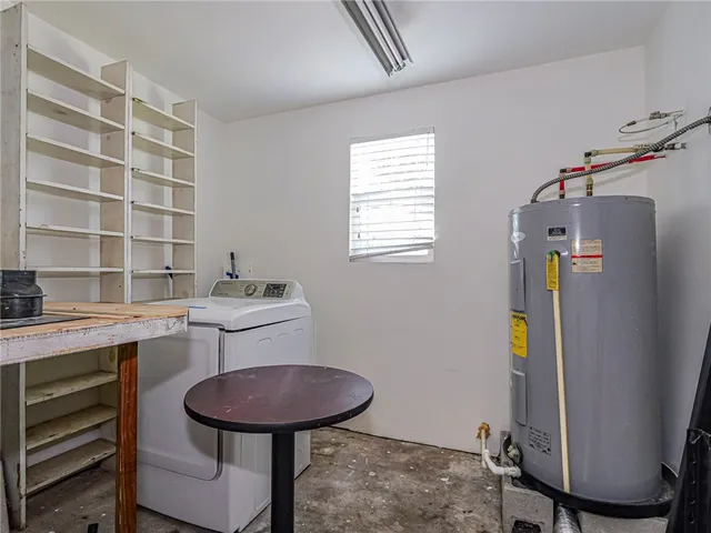 a bathroom with a sink toilet and a mirror
