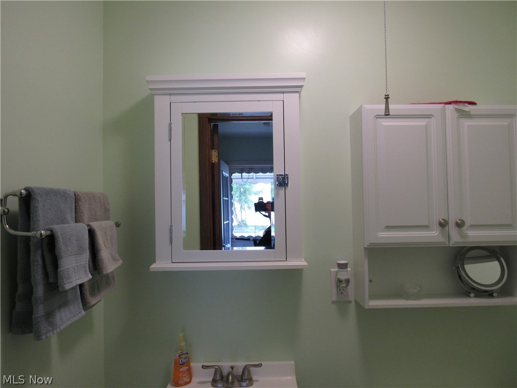 4836 Forest Road Mentor, OH 44060 - Photo 20 of 31 Half bathroom with medicine cabinet & additional storage cabinet!