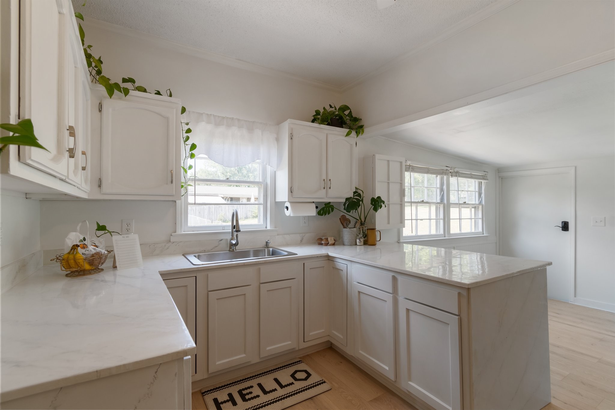 4711 Ollie Chunn Road Spring Hill, TN 37174 - Photo 18 of 64 a kitchen with a sink stove and cabinets