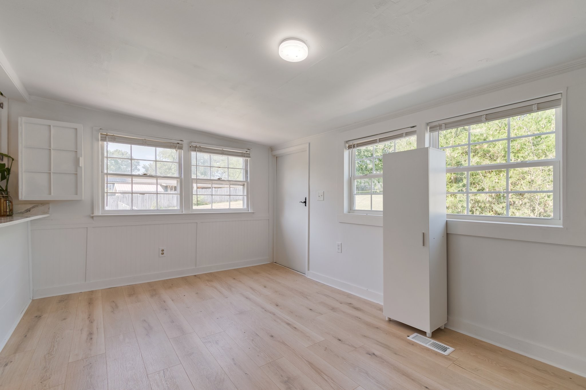 4711 Ollie Chunn Road Spring Hill, TN 37174 - Photo 25 of 64 a view of an empty room with wooden floor and a window