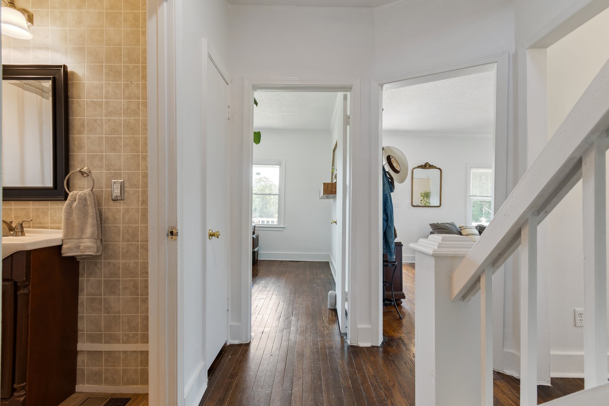 4711 Ollie Chunn Road Spring Hill, TN 37174 - Photo 27 of 64 a view of a hallway with wooden floor and staircase