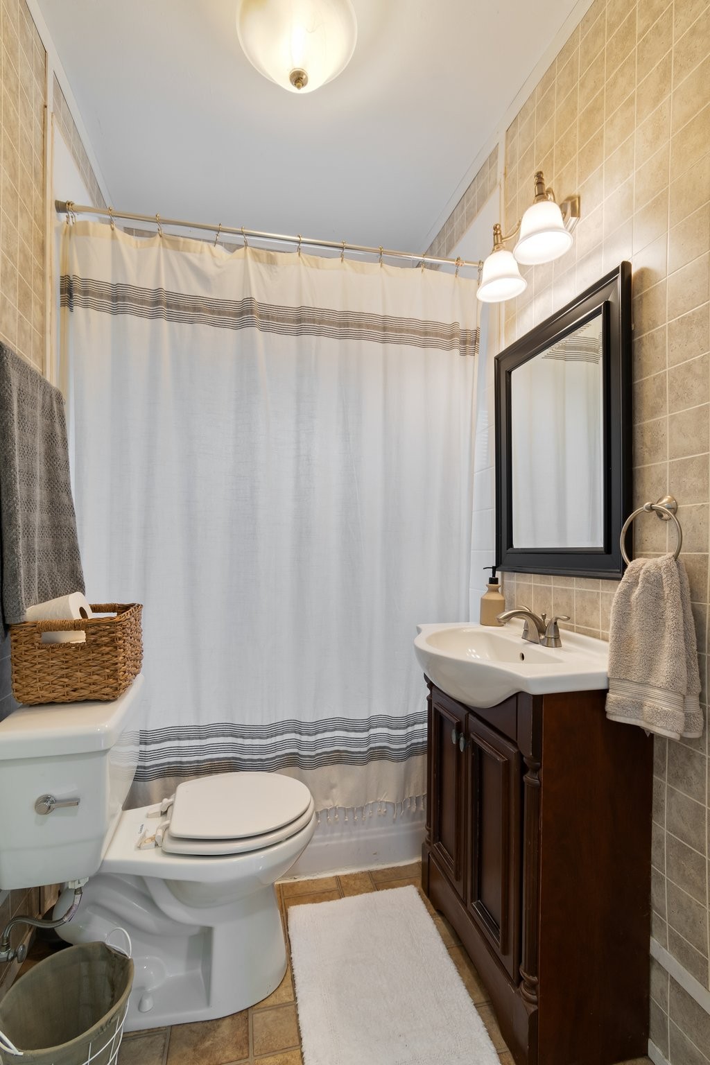 4711 Ollie Chunn Road Spring Hill, TN 37174 - Photo 28 of 64 a bathroom with a granite countertop toilet sink and mirror