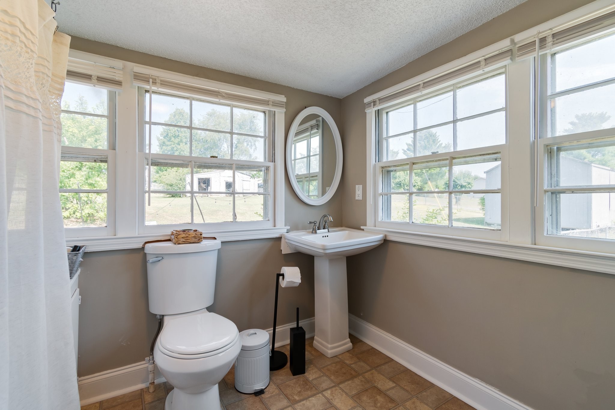 4711 Ollie Chunn Road Spring Hill, TN 37174 - Photo 33 of 64 a view of bathroom with a toilet sink and a window