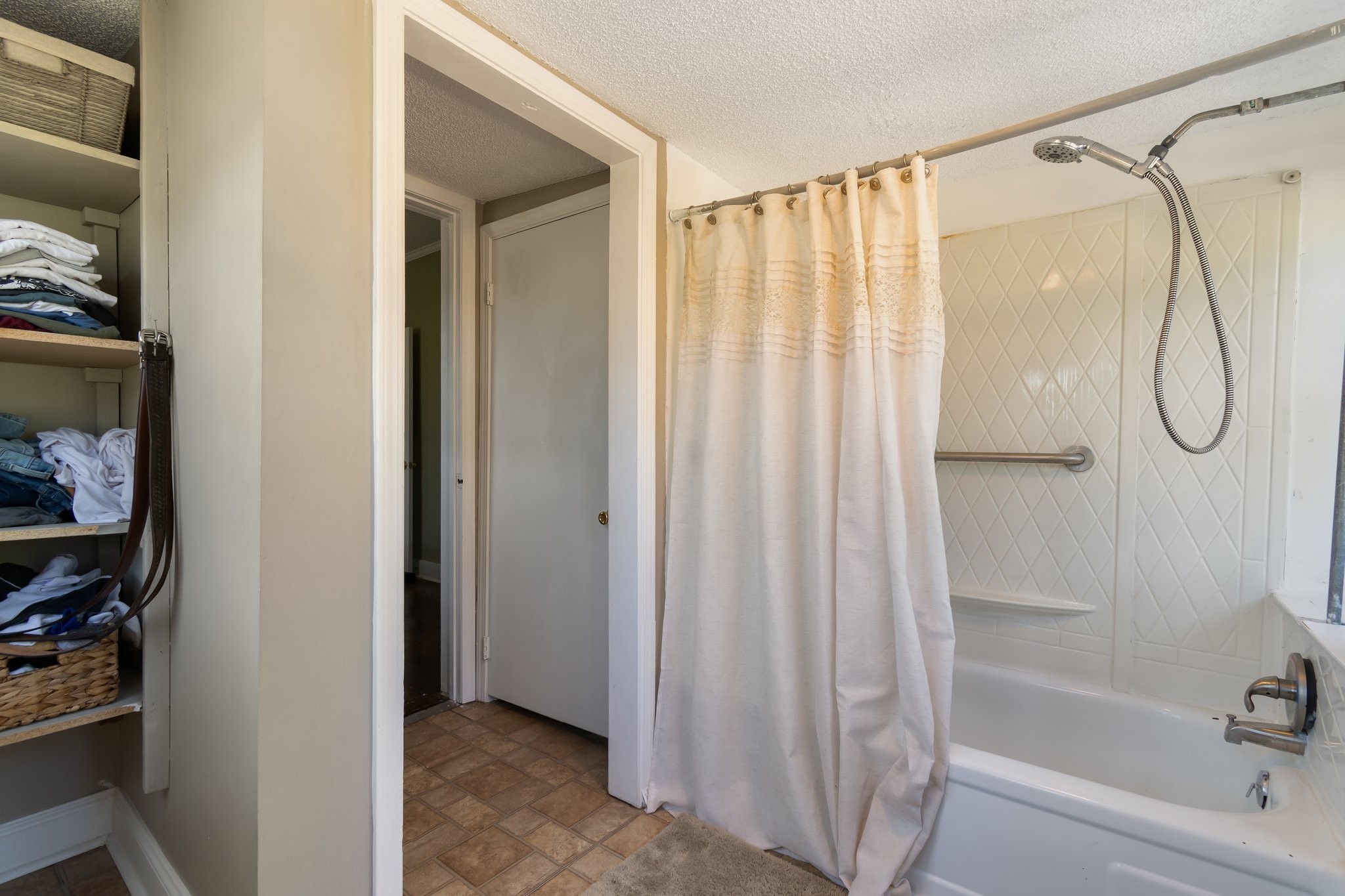 4711 Ollie Chunn Road Spring Hill, TN 37174 - Photo 34 of 64 a bathroom with a bathtub and a shower