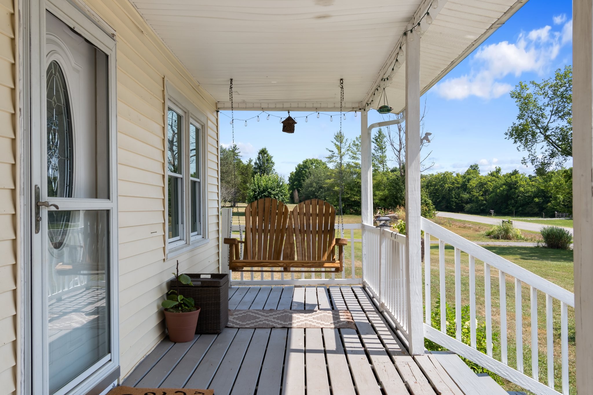 4711 Ollie Chunn Road Spring Hill, TN 37174 - Photo 4 of 64 a view of balcony with wooden floor and fence