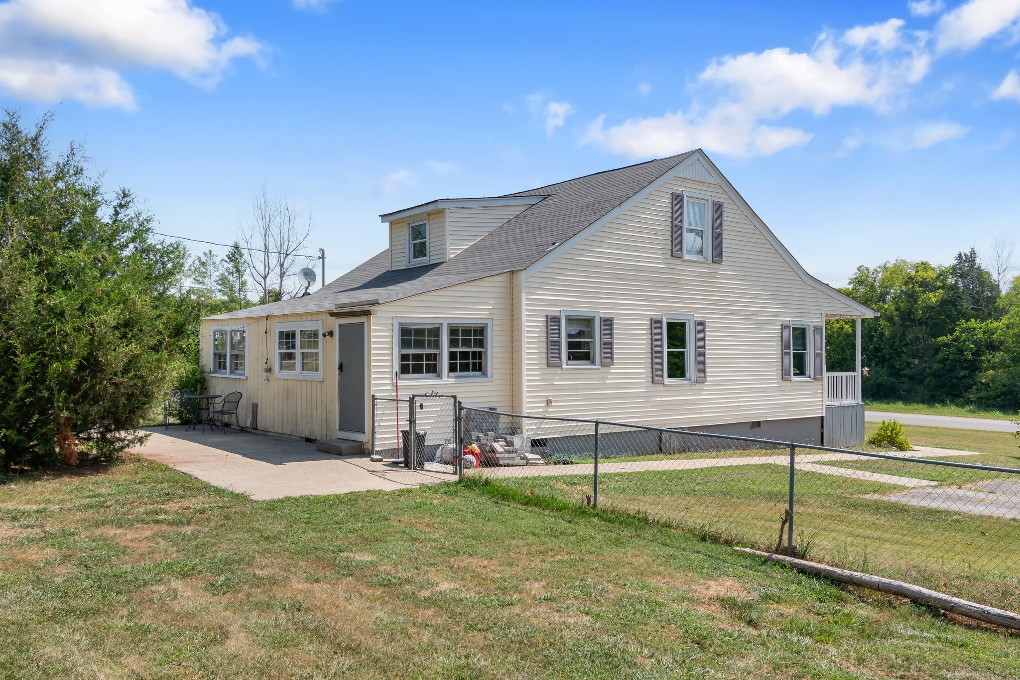 4711 Ollie Chunn Road Spring Hill, TN 37174 - Photo 44 of 64 a view of a house with backyard and a tree