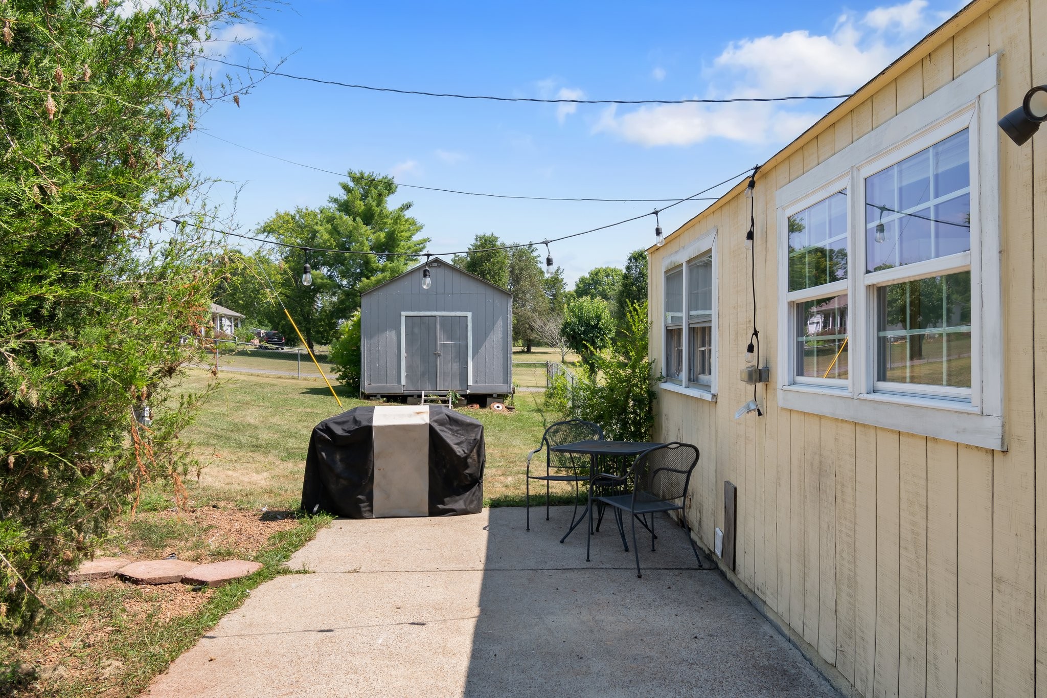 4711 Ollie Chunn Road Spring Hill, TN 37174 - Photo 45 of 64 a front view of a house with outdoor seating