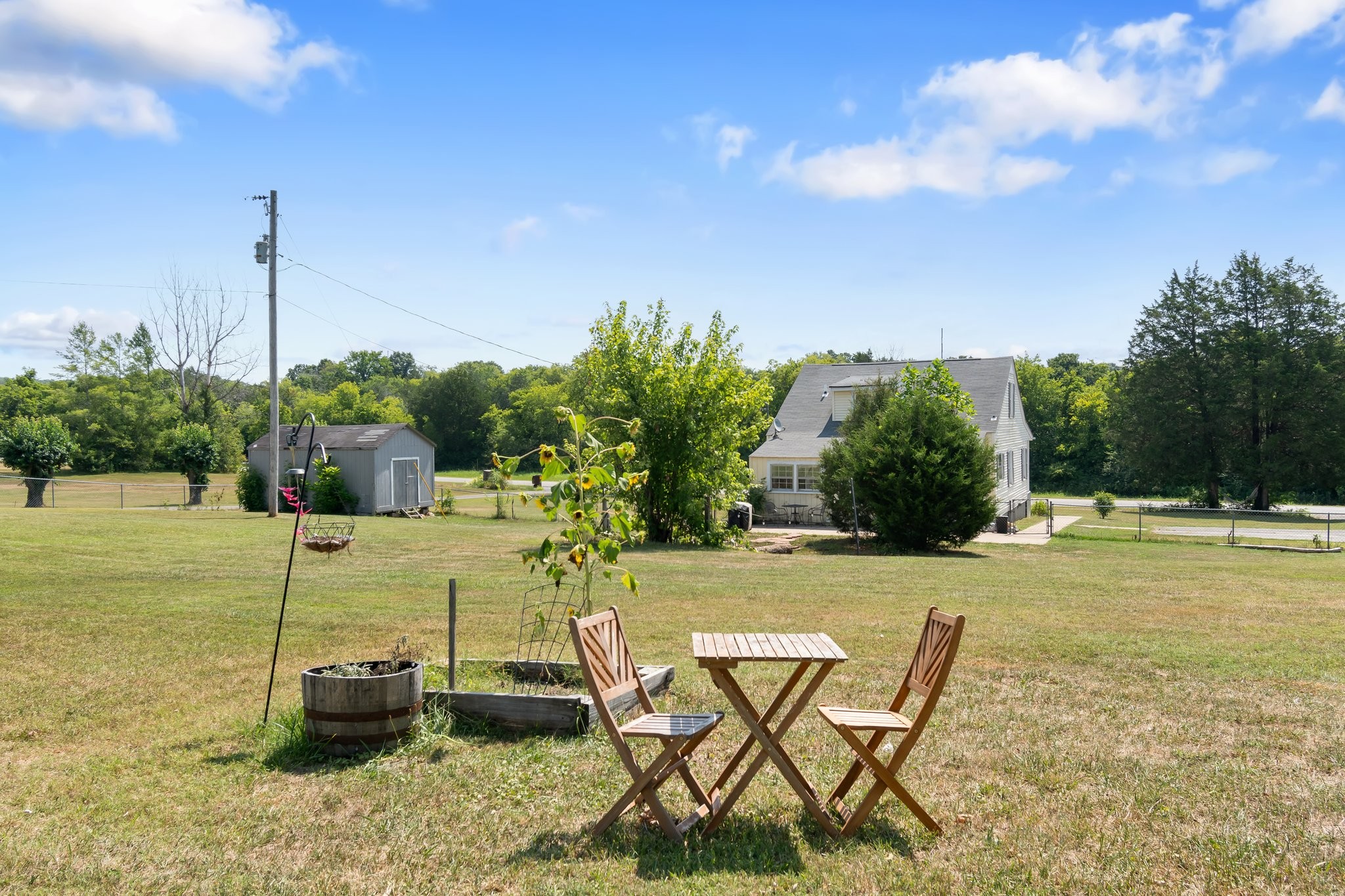 4711 Ollie Chunn Road Spring Hill, TN 37174 - Photo 46 of 64 a swimming pool with some potted plants and palm tree