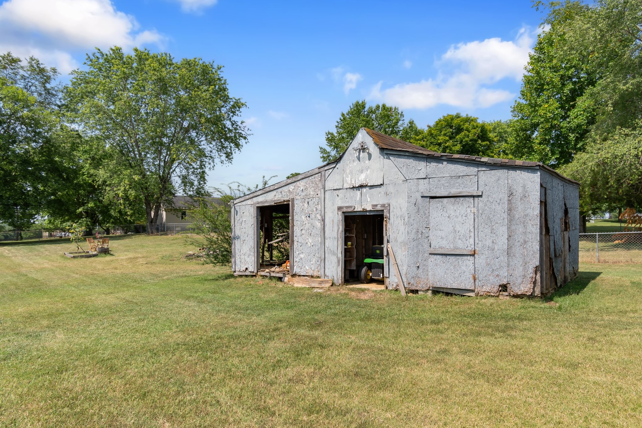 4711 Ollie Chunn Road Spring Hill, TN 37174 - Photo 50 of 64 a view of an house with backyard space and garden
