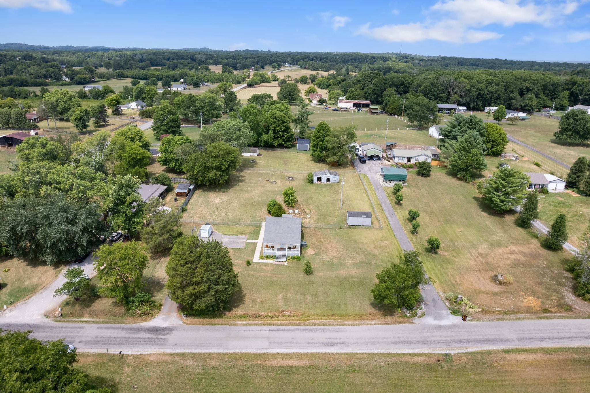 4711 Ollie Chunn Road Spring Hill, TN 37174 - Photo 58 of 64 an aerial view of residential houses with outdoor space and swimming pool