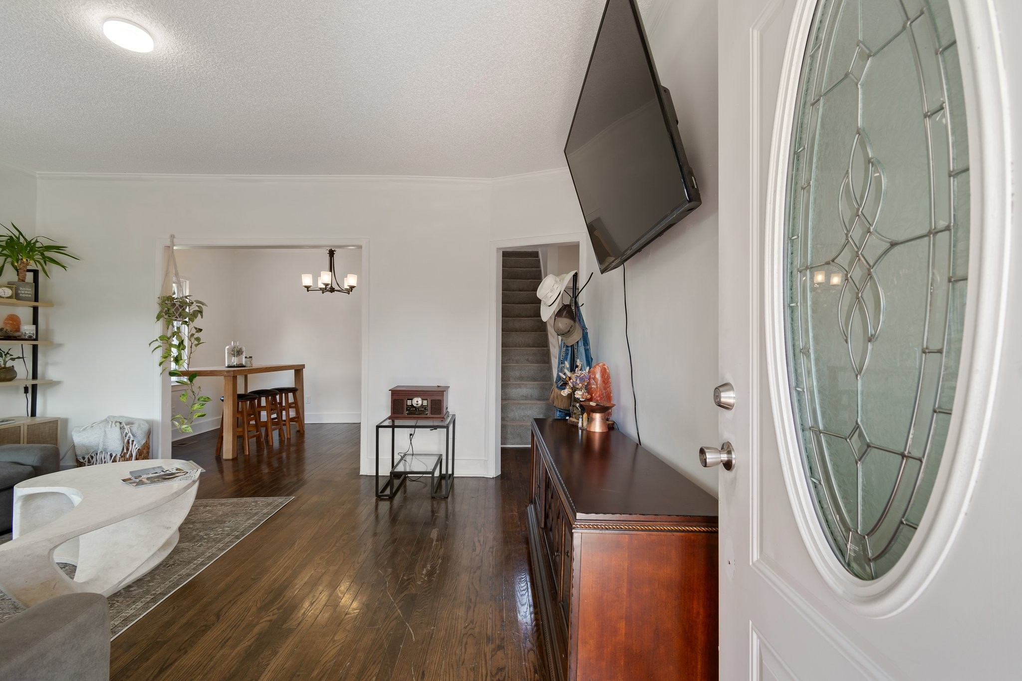 4711 Ollie Chunn Road Spring Hill, TN 37174 - Photo 6 of 64 a view of a hallway with furniture and wooden floor