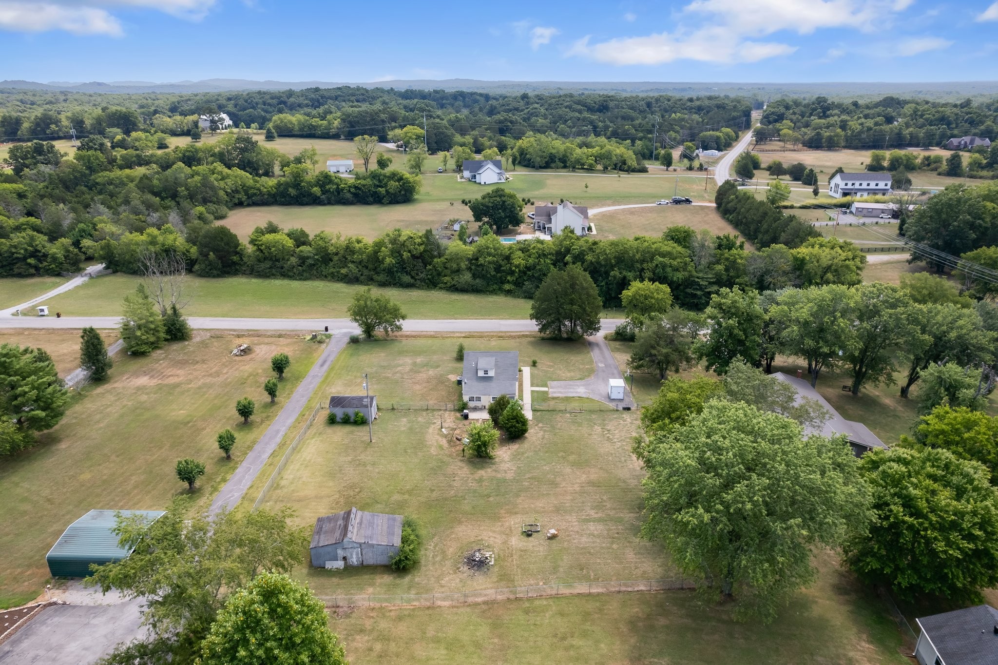 4711 Ollie Chunn Road Spring Hill, TN 37174 - Photo 62 of 64 an aerial view of a house with a garden