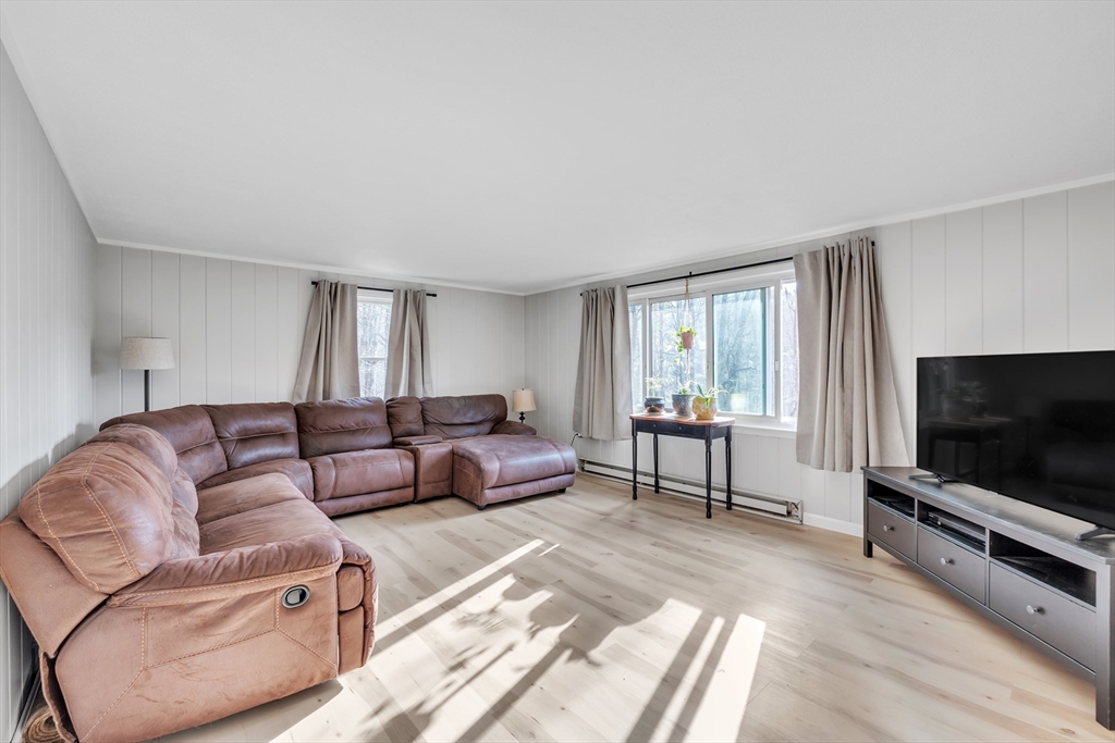 10 Blodgett Road Holland, MA 01521 - Photo 21 of 25 a living room with furniture and a flat screen tv