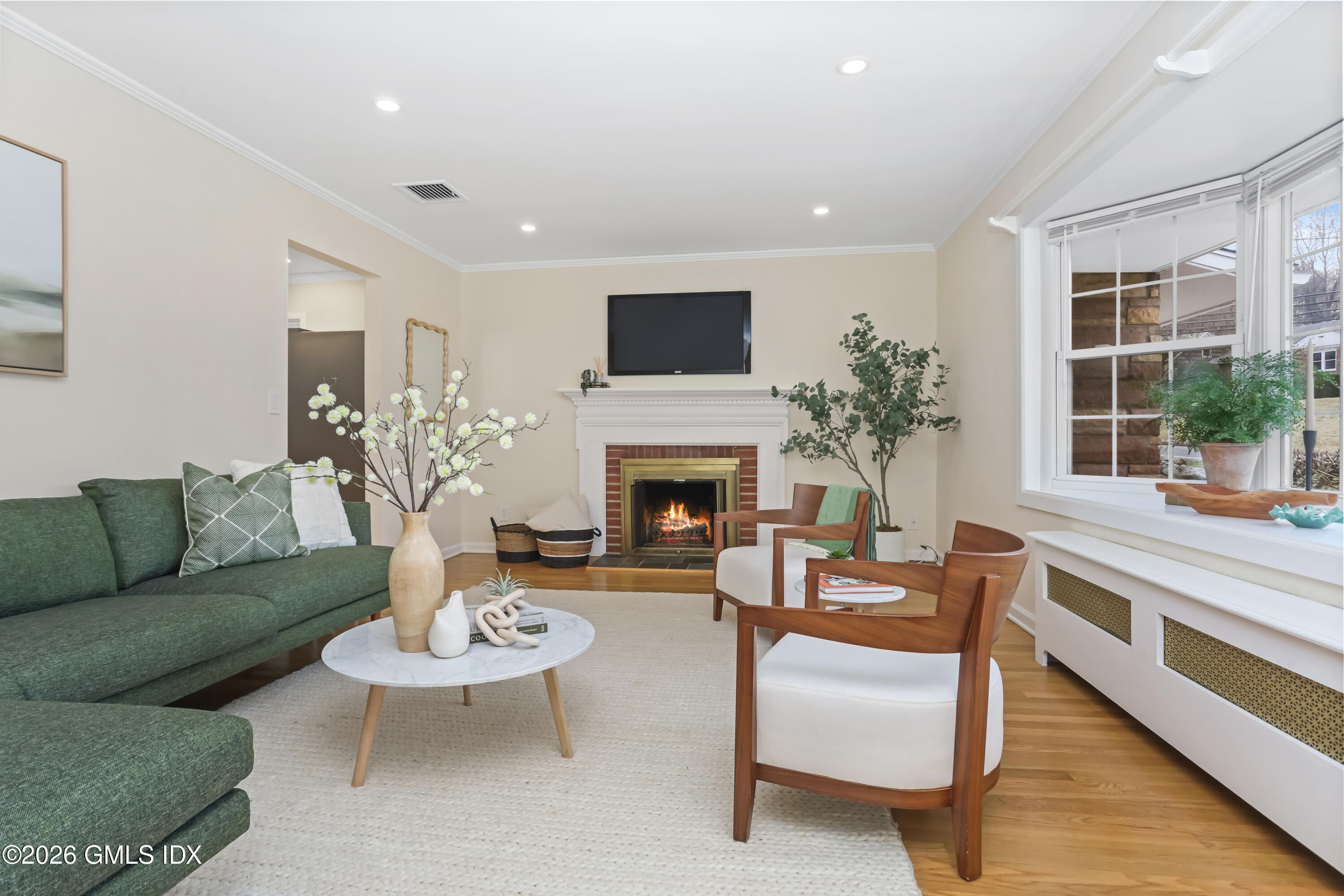 45 Sound Beach Ave Extension Riverside, CT 06878 - Photo 2 of 31 a living room with furniture fireplace and a large window