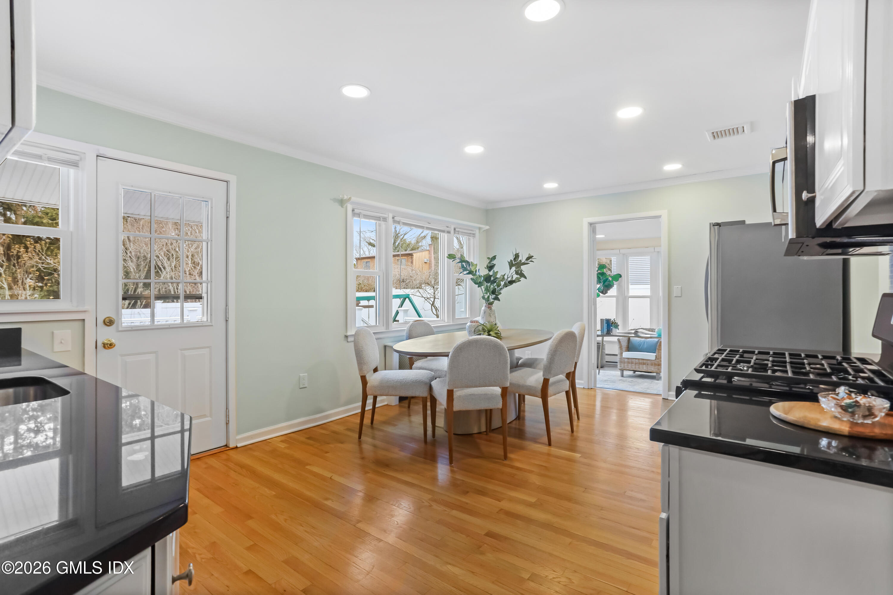 45 Sound Beach Ave Extension Riverside, CT 06878 - Photo 5 of 31 a dining room with furniture and wooden floor