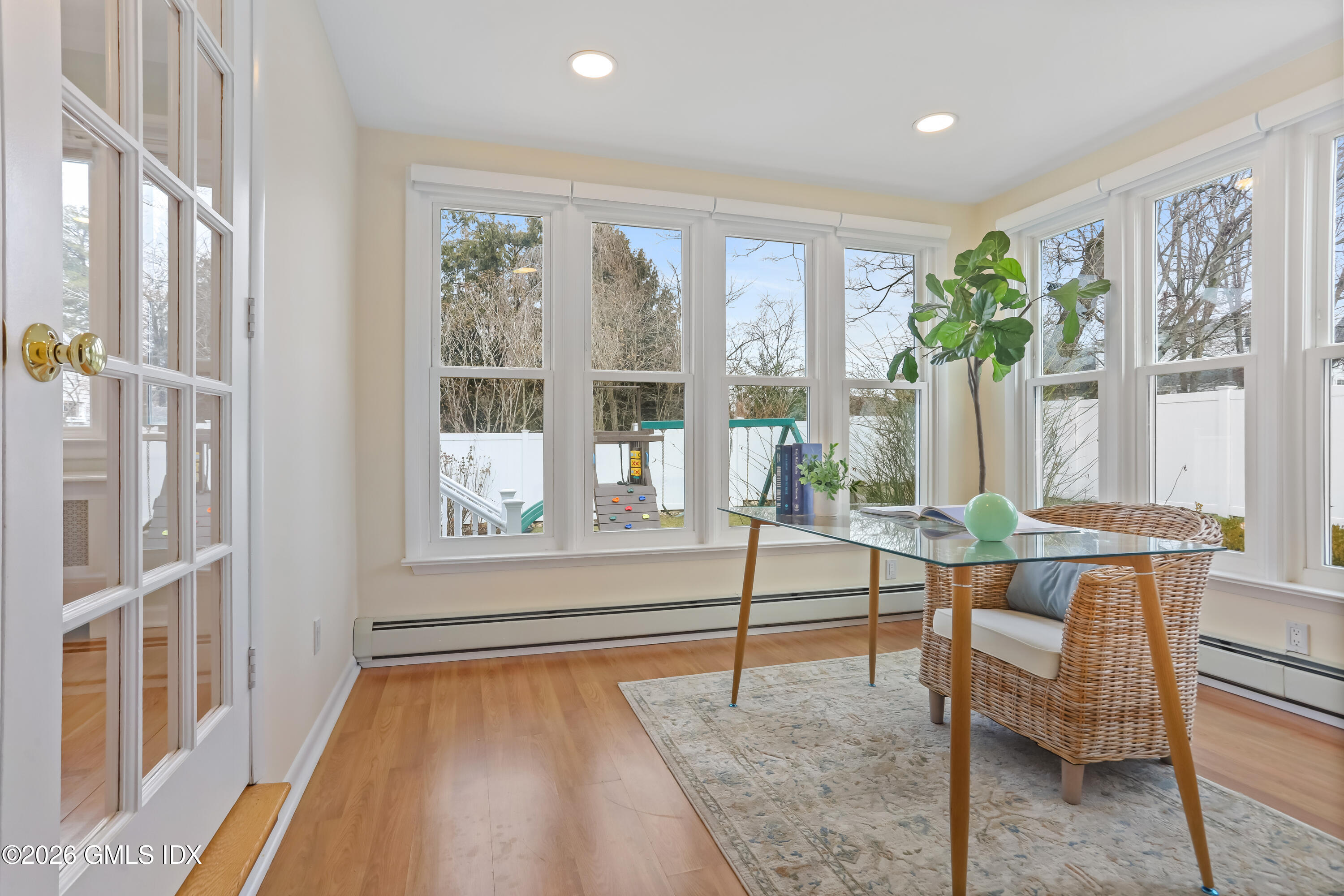 45 Sound Beach Ave Extension Riverside, CT 06878 - Photo 10 of 31 a living room with furniture and large windows