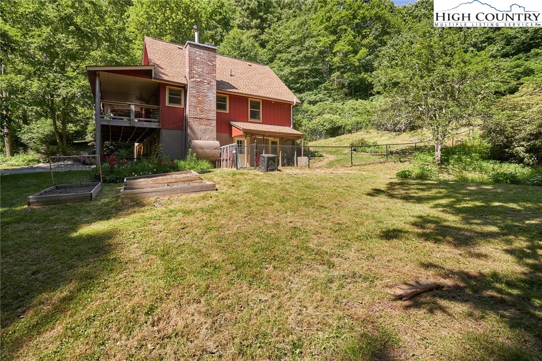 256 Rainbow Mountain Road Boone, NC 28607 - Photo 35 of 45 a front view of a house with a garden