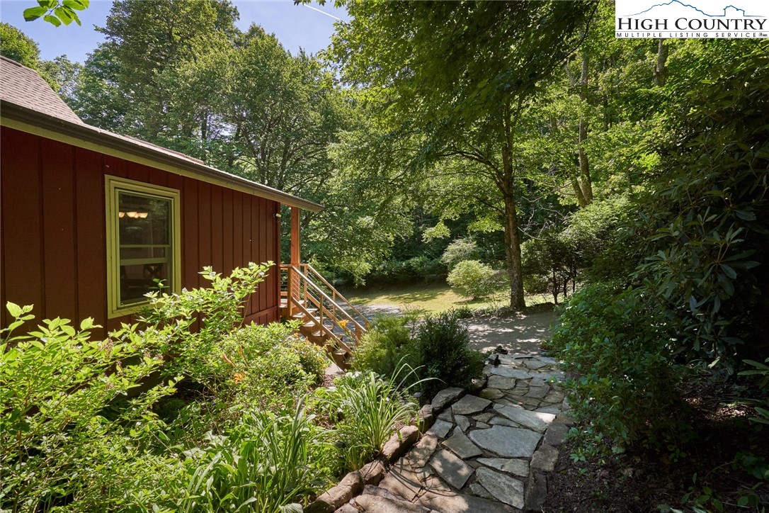 256 Rainbow Mountain Road Boone, NC 28607 - Photo 39 of 45 a backyard of a house with lots of green space