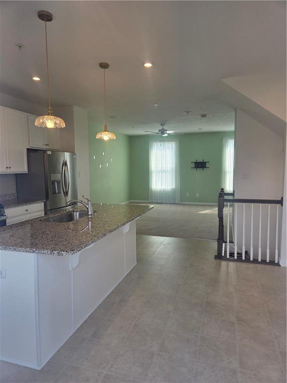 2016 Cade Drive Monaca, PA 15061 - Photo 7 of 32 Island has granite counter. Dining area is to the right.