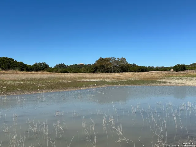 a view of lake view with mountain in the background