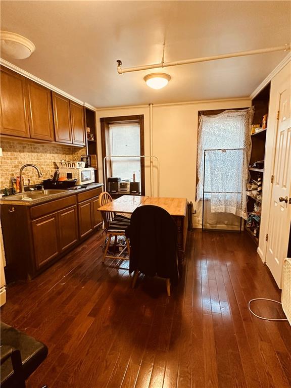 467 56th Street Brooklyn, NY 11220 - Photo 3 of 8 a living room with furniture and a wooden floor